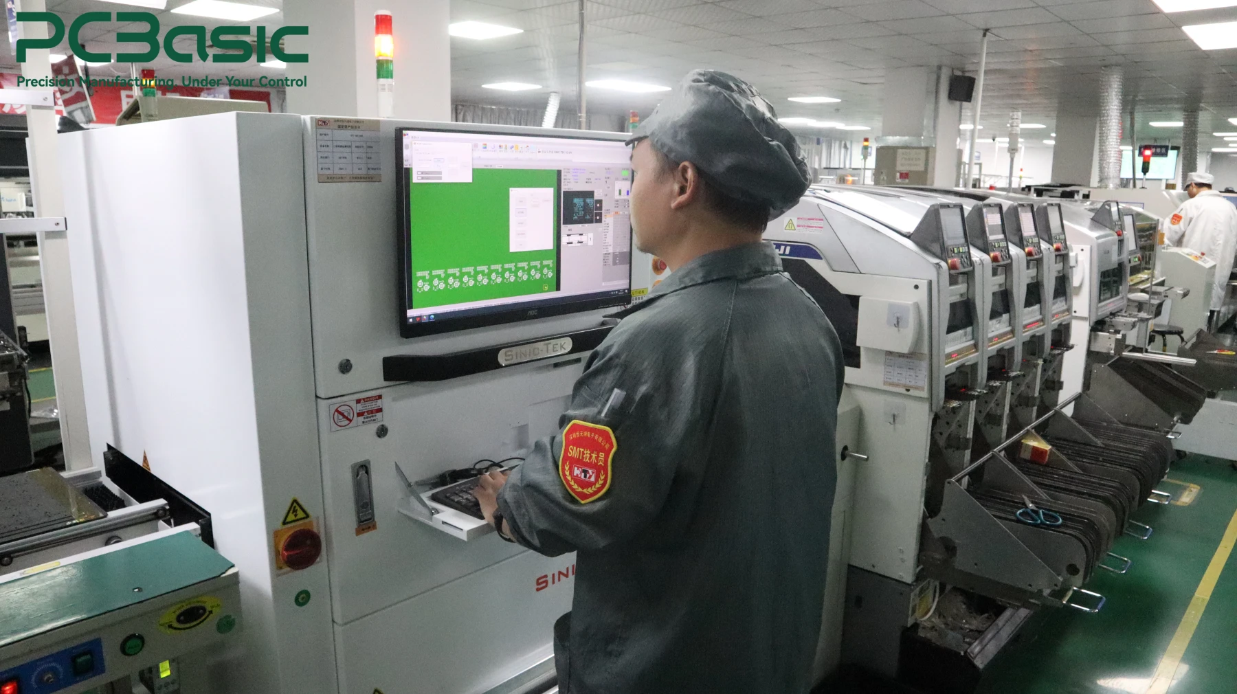 SMT production line operator monitoring PCB assembly process
