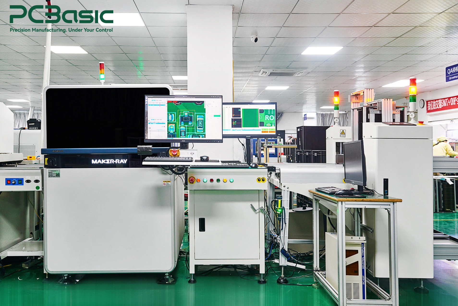 Online AOI equipment inspecting a populated PCB assembly