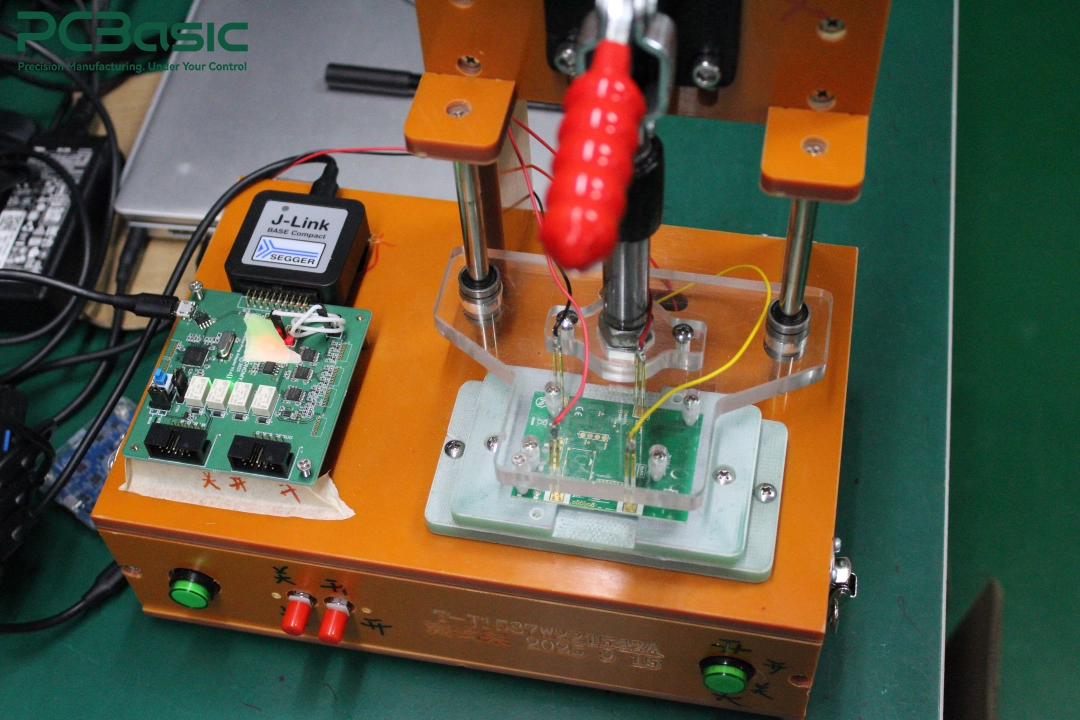 PCBA test fixture with J-Link programmer PCBA test fixture with J-Link programmer