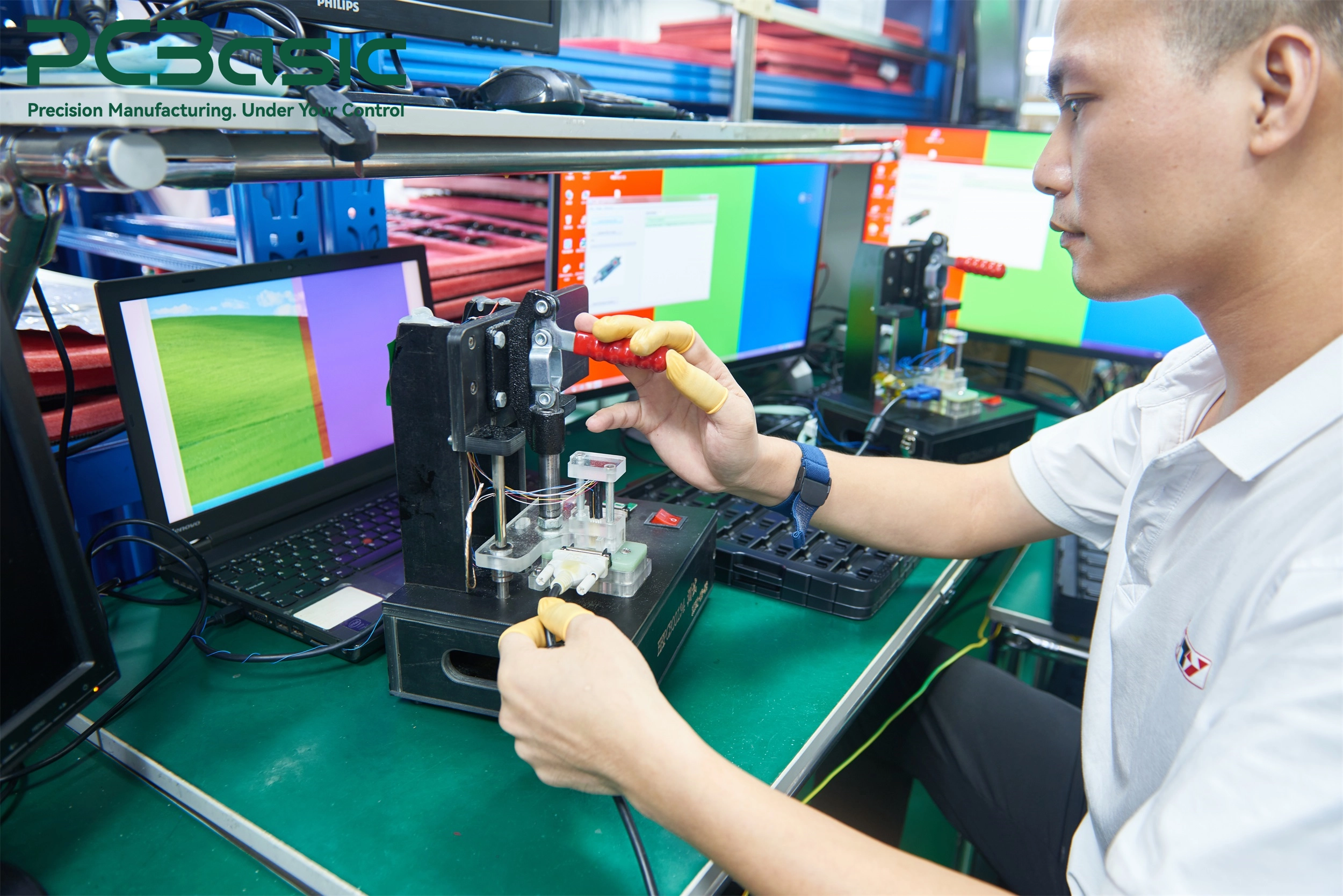 Technician performing PCBA functional testing Technician performing PCBA functional testing